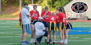 Dunwoody's Montez Swinney works with his girls' flag football team.