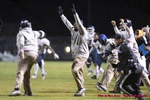 Cedar Grove Head Coach Miguel Patrick and his Cedar Grove coaches and players celebrate Rashod Dubinion's game winning touchdown in a three-overtime playoff win at Rockmart. (Photo by Bruce James)
