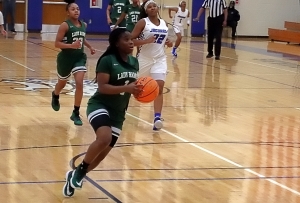 Arabia Mountain's Myori Pruitt (1) rushes up court on a fast break for a basket ahead of Stephenson's Zoey McMicken's (22) during Arabia's 55-52 win. (Photo by Mark Brock)