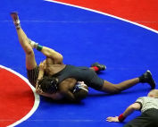 Stone Mountain's Amantee Mills pins Cass' Bryce Kesho for the Class 5A 126 weight class crown. (Photo by Lester Wright)