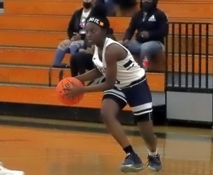 Redan's Kennedy Daniels hit a floater in the lane with 7 seconds to play to propel the Lady Raiders to a 51-49 victory at Douglass to earn a Class 3A State Tournament berth. (Photo by Mark Brock)