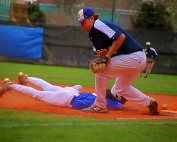 Chamblee's Sydyk Ross dives safely back into first base as Decatur first baseman James White tries to come up with a low throw on a pick-off attempt. Decatur won the Region 5-5A game 11-3. (Photo by Mark Brock)