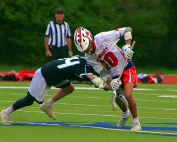 Dunwoody's Casey Blum (10) battles for the faceoff during the Wildcats' 8-6 win over North Atlanta. (Photo by Mark Brock)