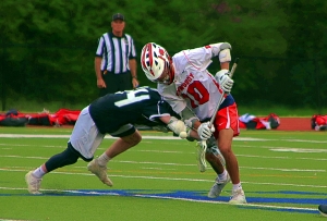 Dunwoody's Casey Blum (10) battles for the faceoff during the Wildcats' 8-6 win over North Atlanta. (Photo by Mark Brock)