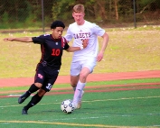 Druid Hills Dani Bibiano (10) maneuvers against Benedictine's Nick Dillon during first half action of the Red Devils 2-0 upset of the 10th ranked Cadets. (Photo by Mark Brock)