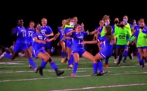 Chamblee's Maci Yeager (8, far right) heads to celebrate with her teammates after hitting the game-winning penalty kick in Chamblee's thrilling overtime Class 5A girls' state playoffs victory against Jackson County. (Photo by Mark Brock)