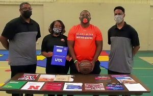 Devin White (third from left) celebrates his college options and choice of the University of Texas-Arlington to play Adaptive Basketball with (l-r) Coach Delton Shoates, mother Monica White, Devin, and Coach Everette Shoates. Not pictured is his father, Darrell White who had to miss due to work obligations. (Photo by Mark Brock)