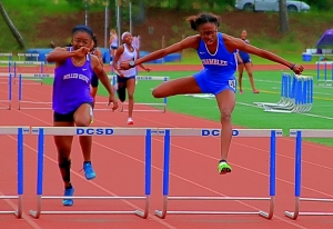 Chamblee's Ariel Raggs (right) won the 300-meter hurdles ahead of Miller Grove's Faith Hill. (Photo by Mark Brock)