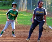 Clarkston's Rah K La (left) checks Lithonia first baseman Kaliyah Poole (right) after getting a lead on a pitch during Lithonia's 22-10 win in Region 5-5A girls' softball action. (Photo by Mark Brock)