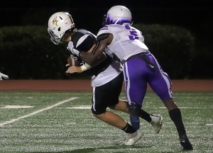 Miller Grove junior linebacker Cayman Spaulding (3) shown making a sack vs. Lakeside had a big night with six tackles for a loss and two interceptions (1 for a touchdown) in the Wolverines 34-27 upset of No. 7 Stephenson. (Photo by Mark Brock)