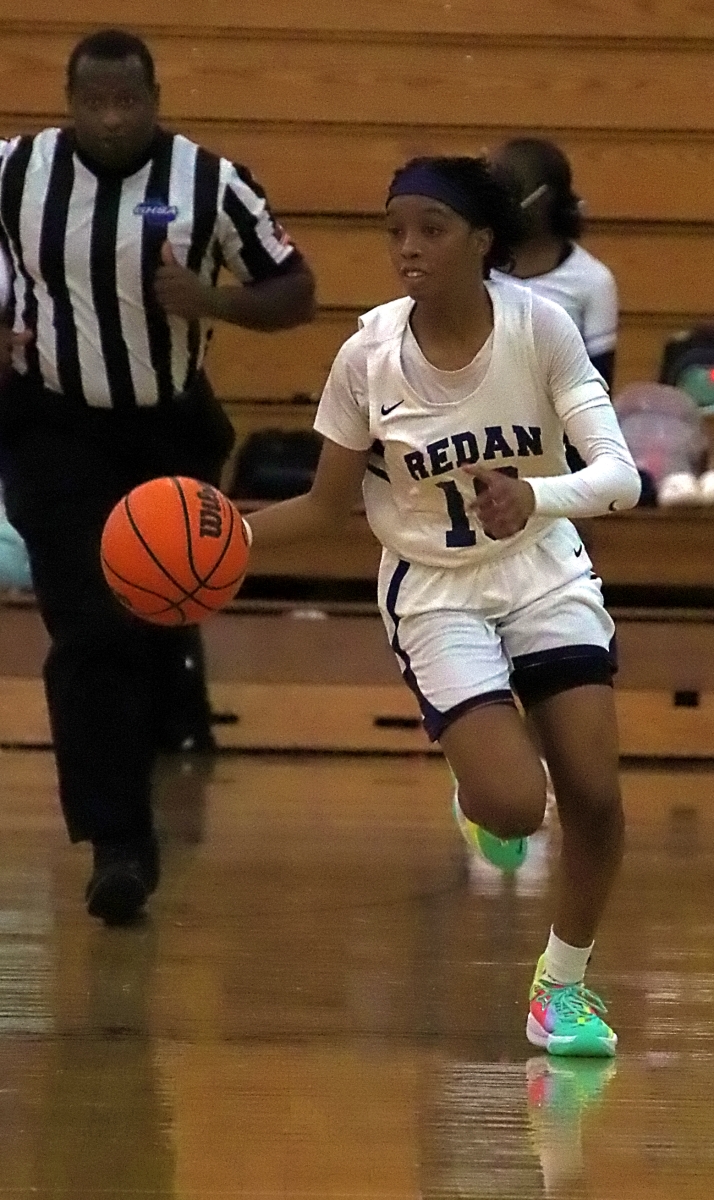 Redan's Jayla Cook scored 18 points and grabbed 10 rebounds in leading the Lady Raiders to a 47-44 win over Heritage in the girls' opening game on Tuesday. (Photo by Mark Brock)