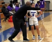 Stephenson girls' Head Coach Dennis Watkins (left) gives instructions to guard Blezzy Abong (right) in a Region 6-4A game against Miller Grove earlier this season. (Photo by Mark Brock)