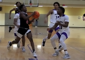 Druid Hills Nicholas Majors (4) goes to the basket in front of Miller Grove's Daniel Brooks Jr. (10) during the Red Devils 49-39 win at Miller Grove on Friday night. (Photo by Mark Brock)