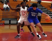 Stone Mountain's Tory Spratt (13) defends in the lane against Chamblee's Eli Star (23). Chamblee won the Region 5-5A matchup 66-57 at Stone Mountain. (Photo by Mark Brock)