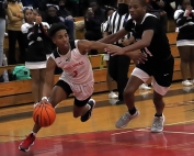 Druid Hills' Karon Strickland (1, shown here in action from earlier in the season) had 16 points as one of four Red Devils in double figures in a 72-44 Class 4A boys' Sweet !6 playoff win at Druid Hills on Saturday. (Photo by Mark Brock)