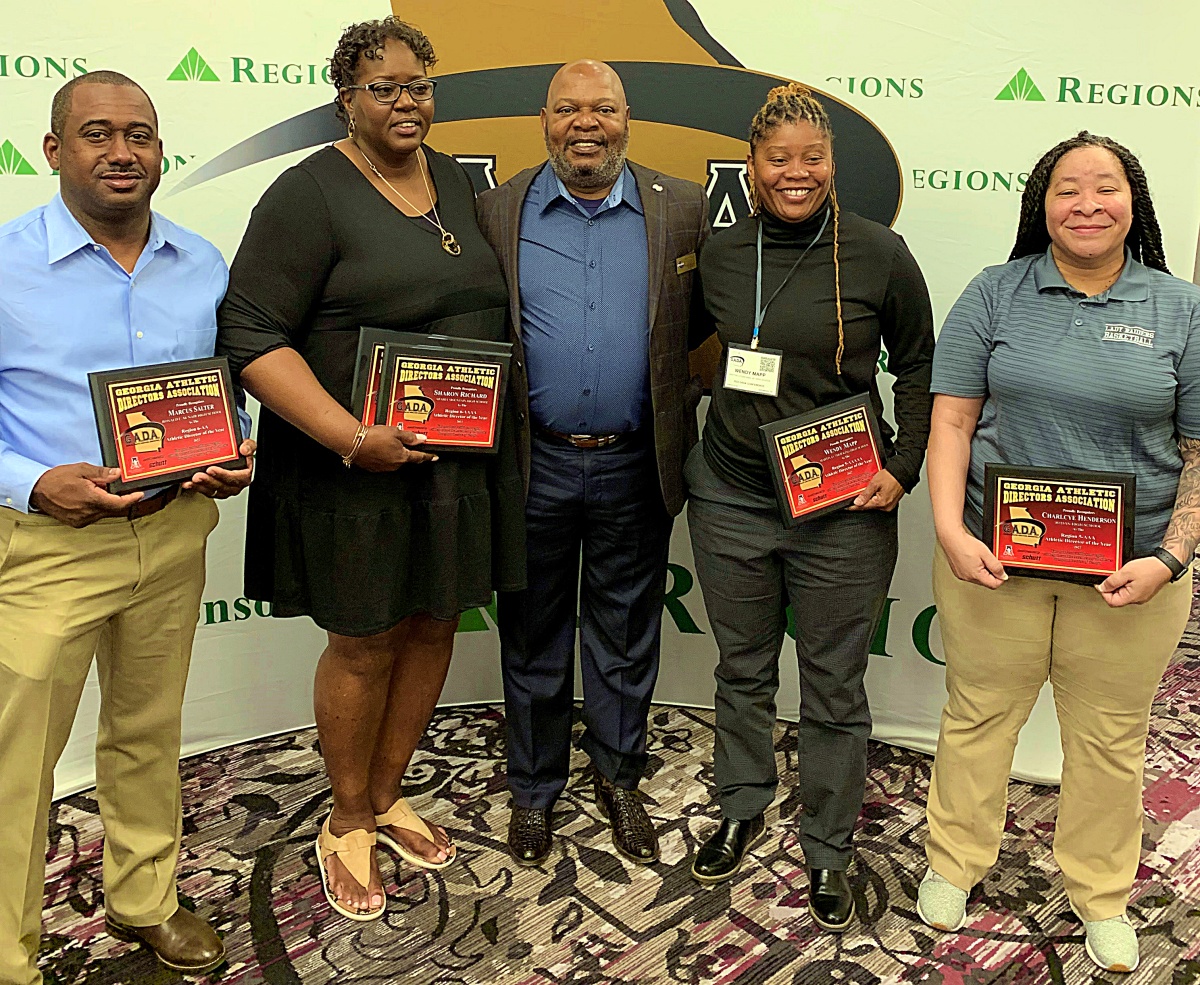 Region Athletic Directors of the Year winners include (l-r) Arabia Mountain Assistant Principal for Athletics Paris Burd (accepting for 6-2A winner Marcus Salter of McNair), Arabia Mountain AD Sharon Ricard (6-4A), unidentified GADA Representative, Martin Luther King Jr. AD Wendy Mapp (5-5A) and Redan AD Charlyce Henderson (5-3A).