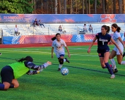Dunwoody's Julia Guild (9) comes up to put a carom off Berkmar goalie Hailey Barrios into the net for one of two of her goals in the 9-0 Region 7-7A victory for Dunwoody. (Photo by Mark Brock)