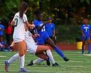 Chamblee's Kara Croone (17) battles Blessed Trinity's Lizzie Heller (12) for a loose ball that got away. Croone did not loose many battles on the night as she scored all three goals in Chamblee's 3-1 win over the No. 1 ranked Titans. (Photo by Mark Brock)