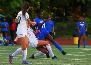 Chamblee's Kara Croone (17) battles Blessed Trinity's Lizzie Heller (12) for a loose ball that got away. Croone did not loose many battles on the night as she scored all three goals in Chamblee's 3-1 win over the No. 1 ranked Titans. (Photo by Mark Brock)