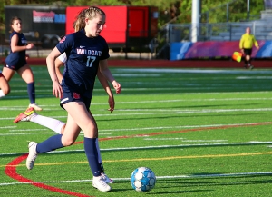 Dunwoody's Lindsey Lampron dribbles down the field during second half action of Dunwoody's 2-1 Class 7A girls' soccer playoff victory. Lampron scored both goals for the Lady Wildcats in the win. (Photo by Mark Brock)