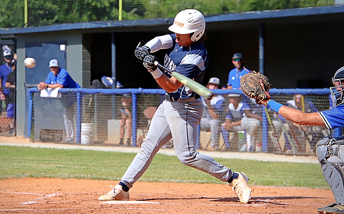 Jason Avila connects for an opposite field home run to put the Redan Raiders ahead 1-0 in the bottom of the first inning in the opening game of their Class 3A state playoff doubleheader sweep over Burke County. (Photo by Mark Brock)