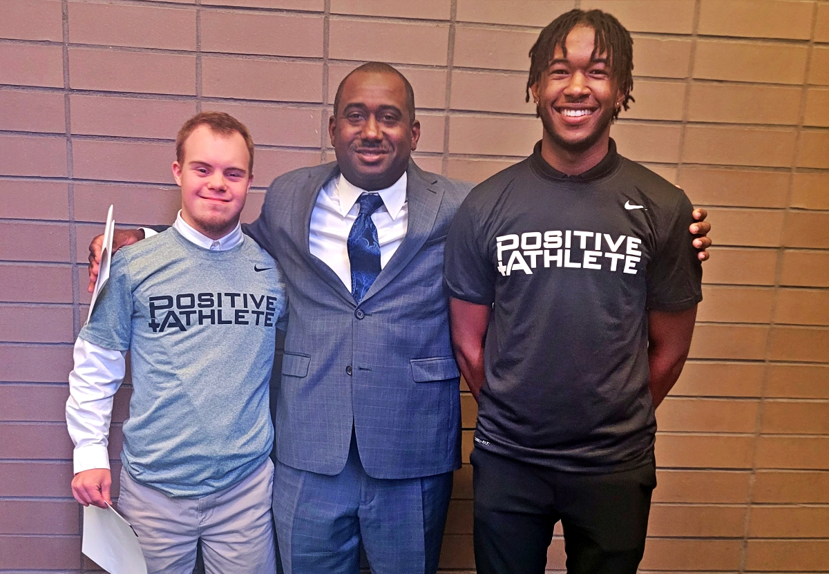 Lakeside's John Gross (far left) and Arabia Mountain's Regshun Lee received Positive Athlete of Georgia Statewide honors for Special Olympics (Boys Swimming) and Boys Track and Field, respectively. Pictured with the two honorees is DCSD Athletics Middle School Coordinator Paris Burd.