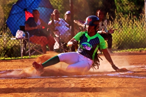 Arabia Mountain's Makayla Smith slides in safely at home during the Lady Rams 18-3 win over the Southwest DeKalb Lady Panthers on Wednesday at Arabia Mountain. (Photo by Mark Brock)
