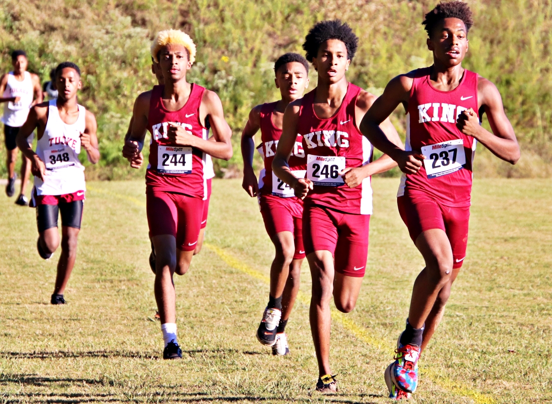 Martin Luther King runners (r-l) Braylin Grier, Kamerson Sutton, C'Andre Reid and Omari Sawyer lead the way on the first lap of the final regular season meet in DeKalb. Eventual individual winner Abdeleselam Korebo of Tucker (far left) is trailing the quartet from King. (Photo by Mark Brock)