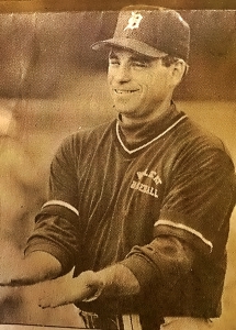 Rick Kneisel gives signals to his team back during his Dunwoody years.