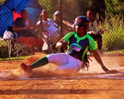 Arabia Mountain's Makayla Smith slides in safe at home in action against Southwest DeKalb earlier this season. Smith and her Arabia Mountain teammates head to Jones County on Thursday to tak on Northside Columbus in the Harris County Class 5A Super Regional. (Photo by Mark Brock)