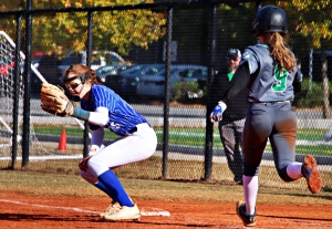 Chamblee first baseman Rachel Axelson makes the grab for an out against McIntosh's Emily Veerman (9) in Chamblee's Game 1 10-2 win. (Photo by Mark Brock)
