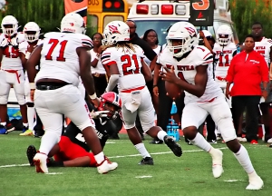 Druid Hills quarterback Jacquez Cullars (1), shown here against McNair earlier this season, threw for two touchdowns and ran for two more in the Red Devils' 39-6 win over Riverside Military last week. (Photo by Mark Brock)