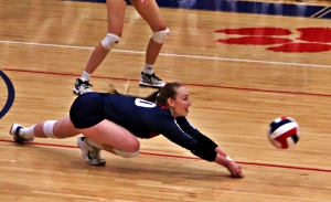 Dunwoody's Hayley Brown comes up with a big dig during her team's 3-0 Class 6A state playoff first round win over Rockdale County. (Photo by Mark Brock)