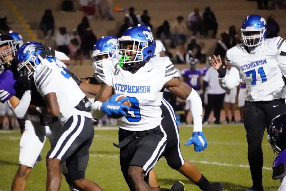 Stephenson's Denver Jones (9) is on the run during the Jaguars 55-20 Region 6-4A win over the Miller Grove Wolverines. (Photo by Jay Phillips, The Champion Newspaper)