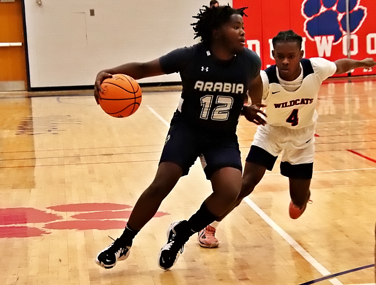 Arabia Mountain's Brendan Rosse (12) drives against Dunwoody's Cameron Butler (4) during the Rams road win on Tuesday night. (Photo by Mark Brock)