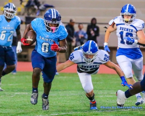 Boden Walker hit for a 60-yard touchdown run to get the Cedar Grove Saints rolling in a 48-7 win over the Bremen Blue Devils in the first round of the Class 3A state playoffs. The Saints host Hebron Christian on Friday at Godfrey Stadium. (Photo by Vincent Myers)