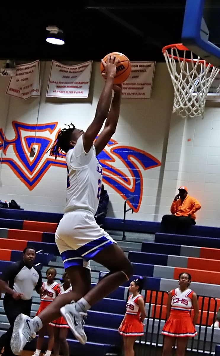 Columbia's Jamarcus Hatcher flies in for an easy basket in Columbia's 79-40 Region 5-2A win on Friday. (Photo by Mark Brock)