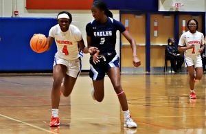 Columbia's Kamri Gilbert (4) races up court against North Cobb Christian's Brook Moore (3) during Columbia's Class 2A first round loss. (Photo by Mark Brock)