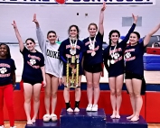 The Dunwoody Lady Wildcats won their eighth overall DeKalb County gymnastics title on Saturday. It was the first for the team since 2011. (Photo by Mark Brock)