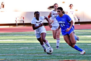 Chamblee's Alessandra Washington (24) races up field ahead of Northside's Lauren Nickerson (10) during Chamblee's 9-0 first round playoff win. Washington finished the night with 3 goals and 1 assist. (Photo by Mark Brock)