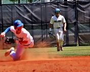 Chamblee shortstop Joey David comes up to one knee to get the force out at second in early inning action against Northside. (Photo by Mark Brock)