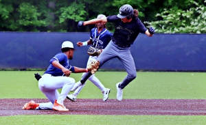 Redan shortstop Bernard Moon gets the easy tag out of Rockmart's Hunter Atkins following a nice throw by catcher Adriel Martinez. Moon was a combined 3-6 at the plate with 4 runs scored, 3 RBI, a home run and two doubles in the two wins. (Photo by Mark Brock)