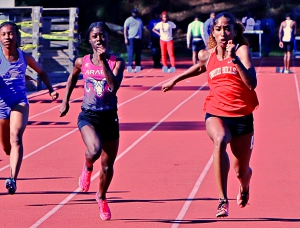 Arabia Mountain's Davenae Fagan (left) qaulified first in three events at the Class 5A State Sectional while Druid Hills' Sanaa Frederick (right) qualified in two sprint events. (Photo by Mark Brock)
