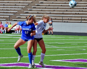 Chamblee senior Cameron Pfau (10) battled Greenbrier's Madison Crouch (6) for a header attempt during first half action against Greenbrier. Pfau scored two second half goals in the 9-0 win. (Photo by Mark Brock)