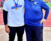 Cedar Grove senior Solomon Hall (left) and Coach Darren Spence celebrate Hall's gold medal in the shot put at the Class 3A state competition.