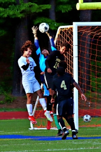 Tucker keeper William Perez Lopex (light blue top) repelled  four Peachtree shots in a two minute span in the first half to keep the Tigers up 1-0 at the half. (Photo by Mark Brock)