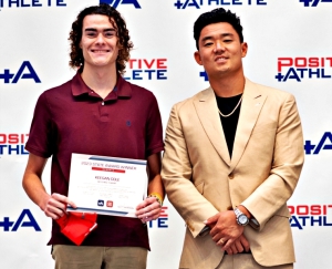 Lakeside senior Keegan Cole (left) received the Postive Athlete Multi-Sports Athlete award from Atlanta Falcons' placekicker Youngho Koo (right) during recent ceremonies at the College Football Hall of Fame in Atlanta.