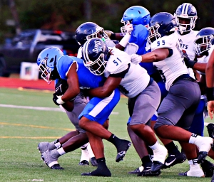 Stephenson's Devin Ingram (with ball) tries to get away from Cedar Grove's Chase Kerns (51) during preseason scrimmage action. Both teams take on non-DeKalb opponents on Saturday at Morehouse College. (Photo by Mark Brock)
