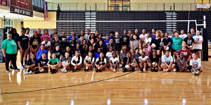 DCSD Volleyball Clinic participants/coaches got together for a group shot after participating in drills to improve their games. (Photo by Ozzie Harrell)