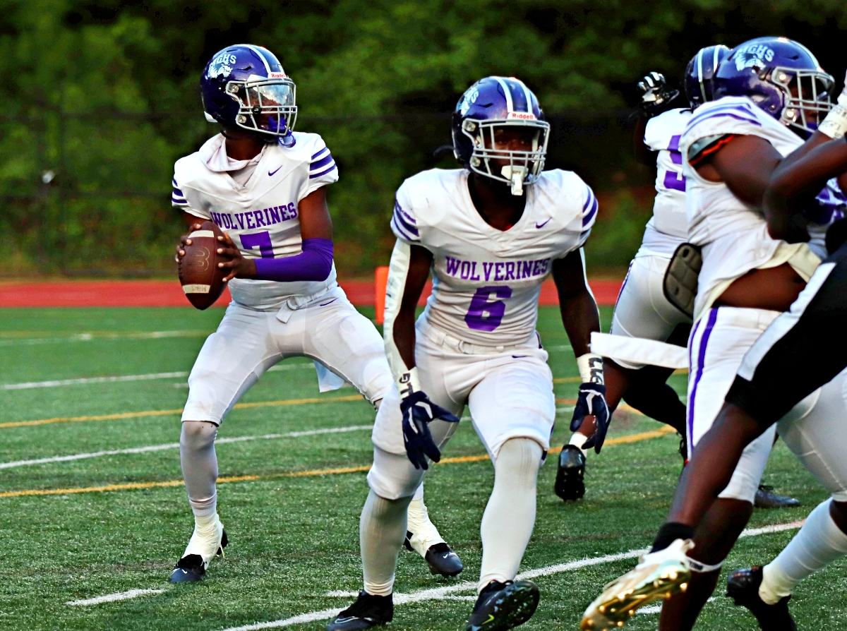 Miller Grove's Amonte Harden (7) sets up to pass in the pocket in the Wolverines loss to Tucker. (Photo by Mark Brock)